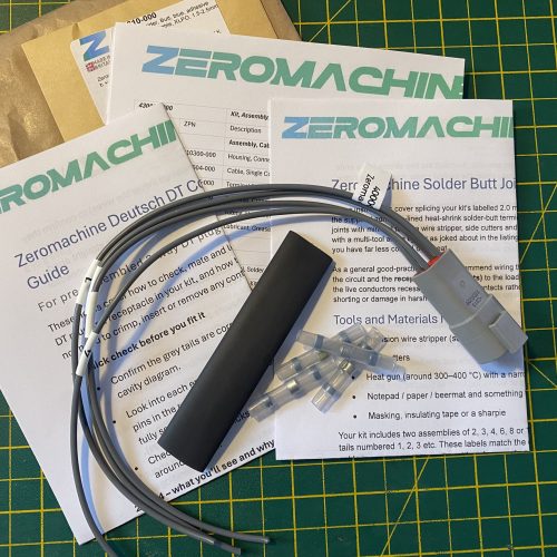 Deutsch DT04-4P-C015 4-way pin receptacle pigtail kit contents showing plug, cable tails, heat shrink, solder butt connectors and assembly guides — Voltforge 430014-000