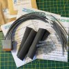 Deutsch DT06-12S-C015 12-way socket plug pigtail kit contents showing plug, cable tails, heat shrink, solder butt connectors and assembly guides — Voltforge 430019-000