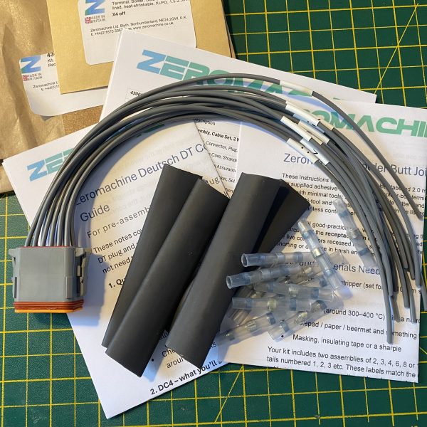 Deutsch DT06-12S-C015 12-way socket plug pigtail kit contents showing plug, cable tails, heat shrink, solder butt connectors and assembly guides — Voltforge 430019-000