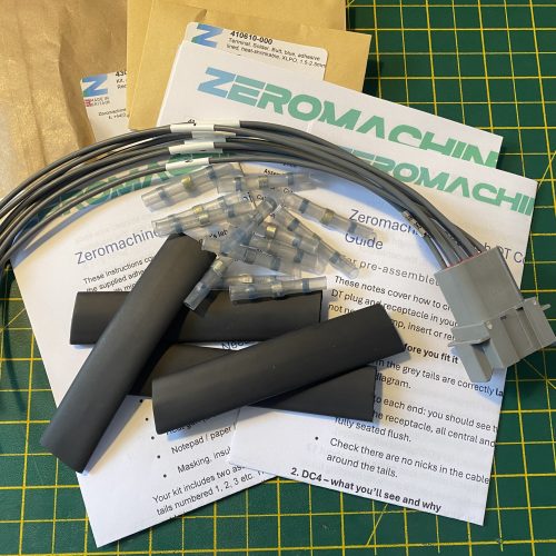 Deutsch DT04-8P-C015 8-way pin receptacle pigtail kit contents showing plug, cable tails, heat shrink, solder butt connectors and assembly guides — Voltforge 430018-000