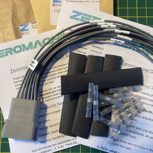 Deutsch DT04-12P-C015 12-way pin receptacle pigtail kit contents showing plug, cable tails, heat shrink, solder butt connectors and assembly guides — Voltforge 430020-000
